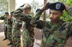 The saying "issued not earned" came around the time the black beret was mandated for all soldiers to wear after basic training was completed
