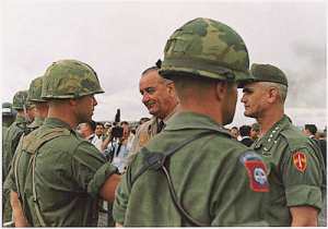 In the early days of Vietnam a color combat patch was worn instead of the black and green patch adopted in the 1970s to go with the field uniform
